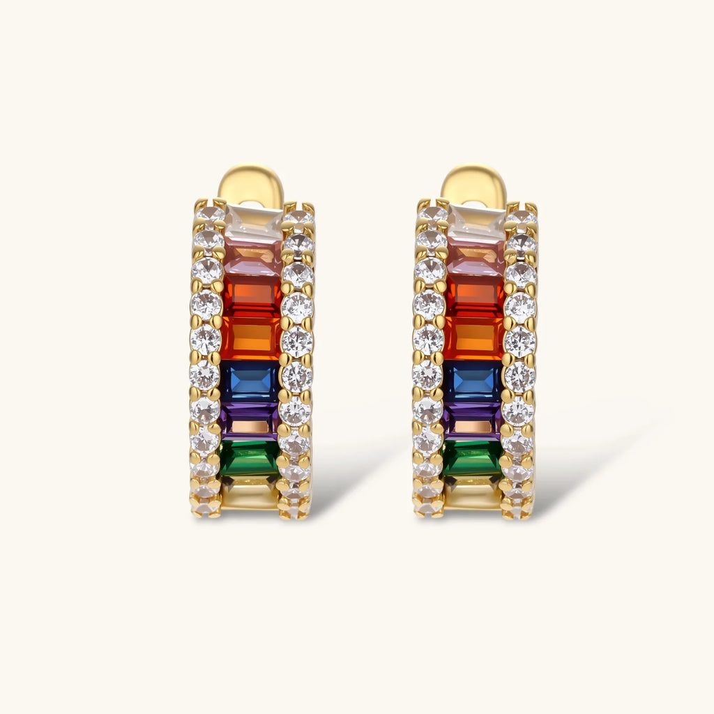 Multicolored gemstone earrings with gold accents on a white background