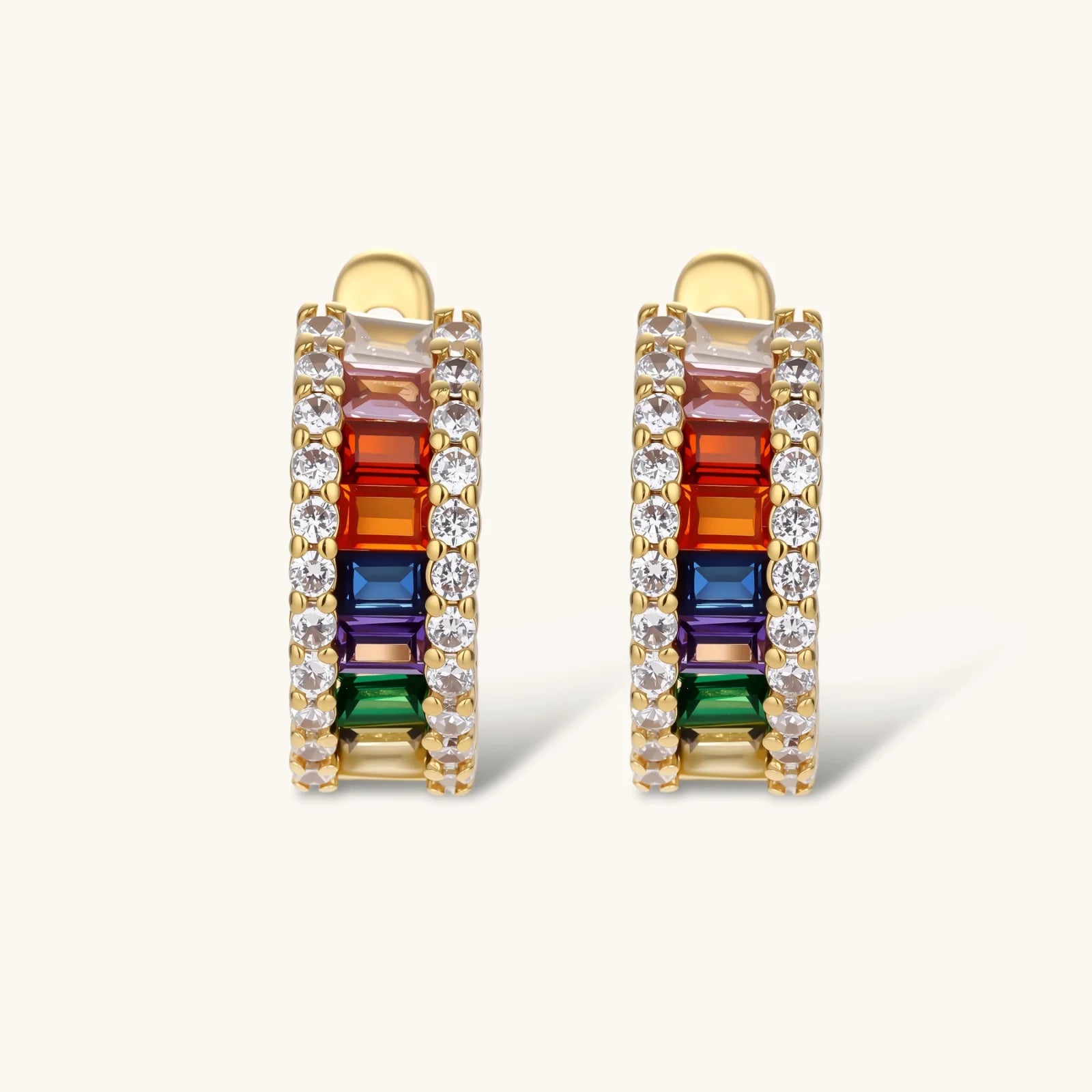 Multicolored gemstone earrings with gold accents on a white background