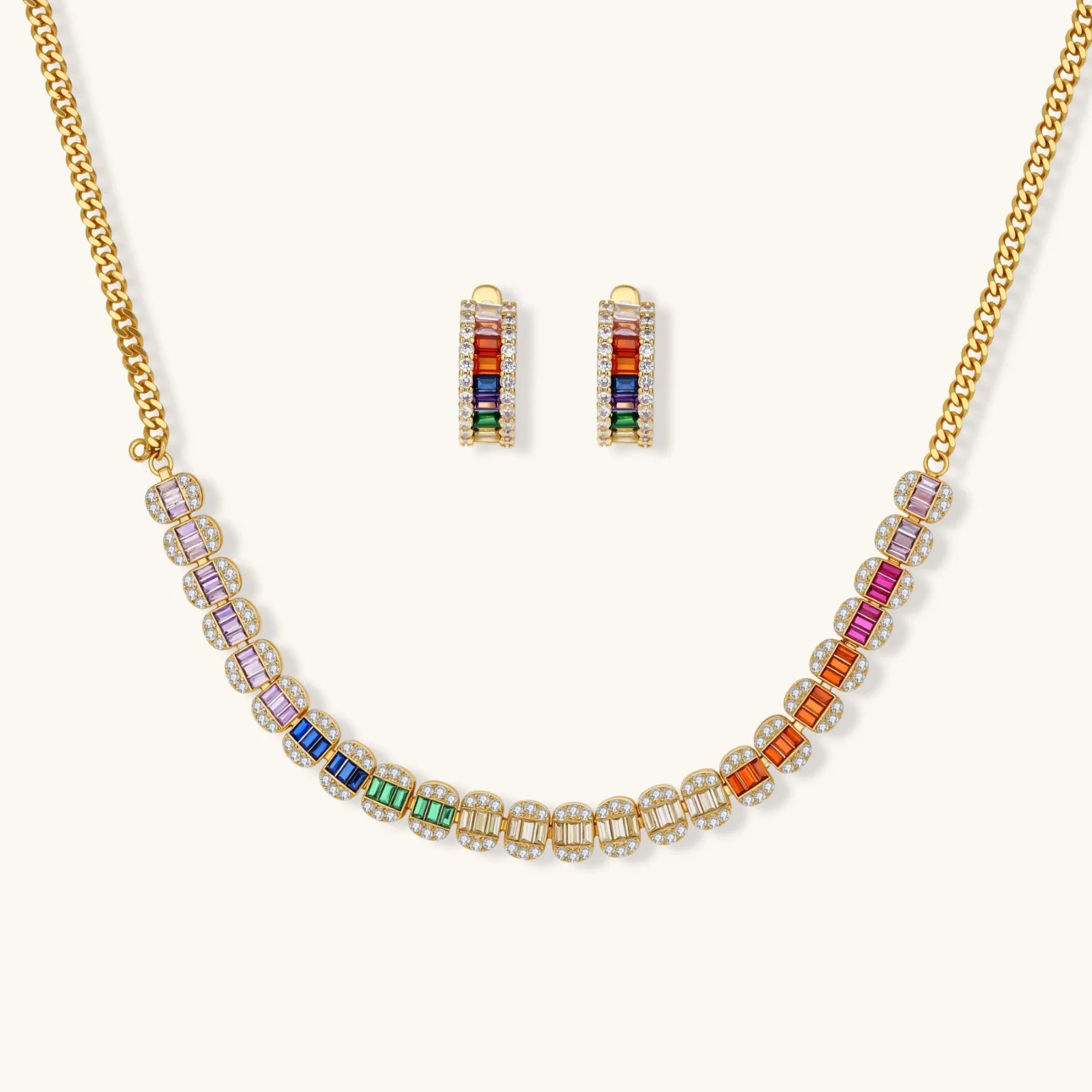 Jewelry set with rainbow beads on a gold chain necklace and earrings on a white background