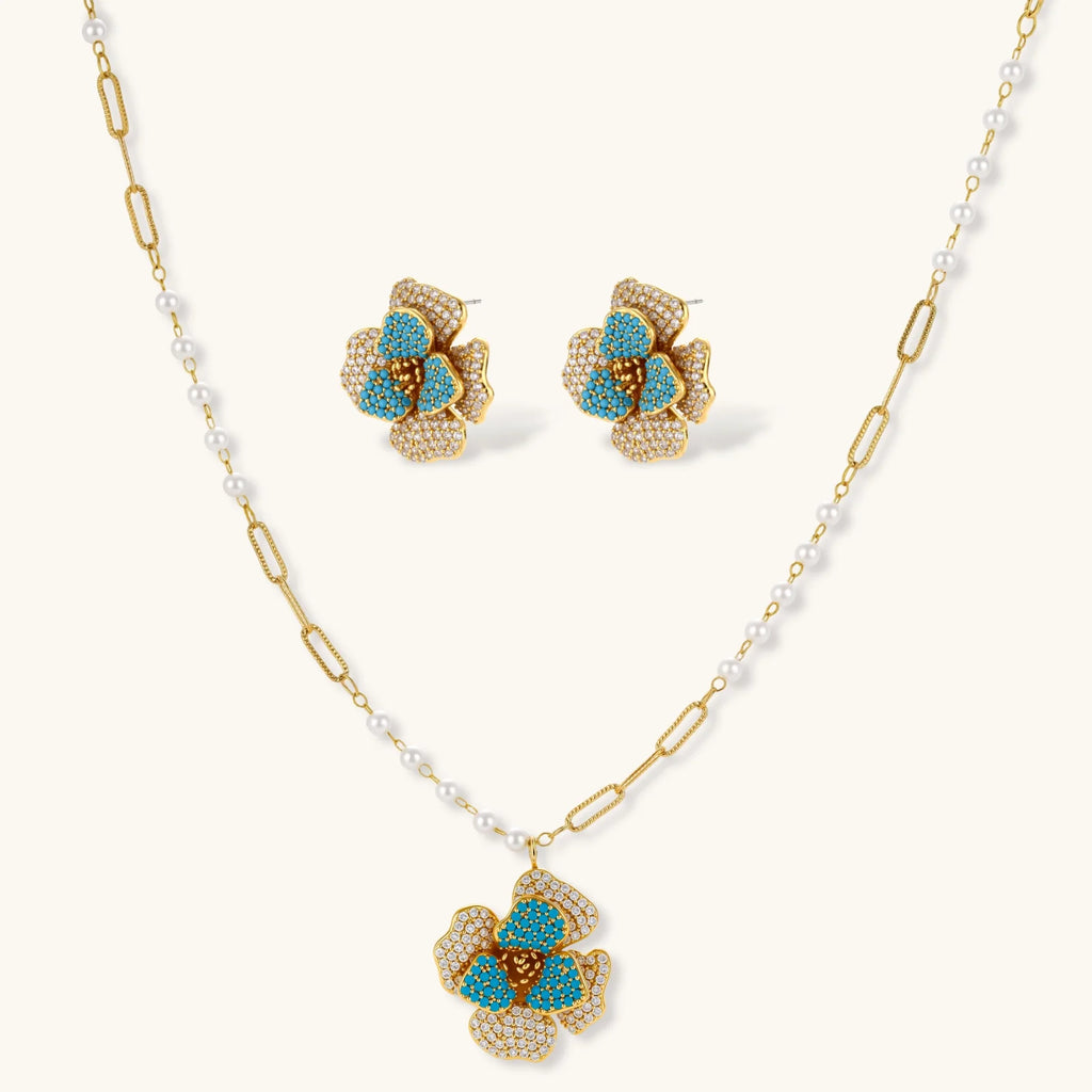 Jewelry set with floral earrings and necklace on a white background
