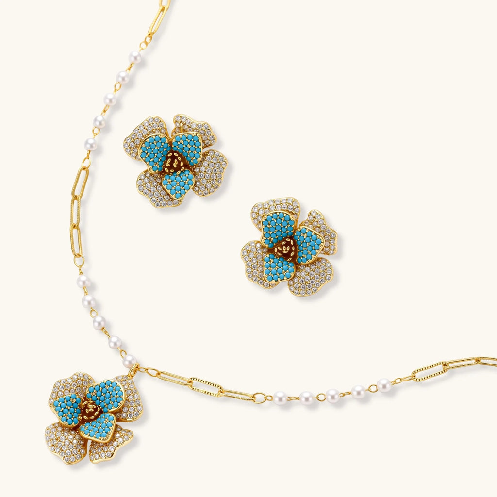 Jewelry set with floral earrings and necklace on a white background
