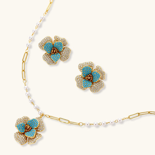Jewelry set with floral earrings and necklace on a white background