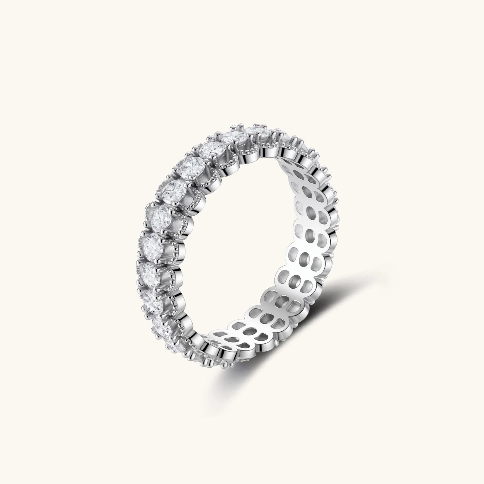 Silver ring with diamond accents on a white background