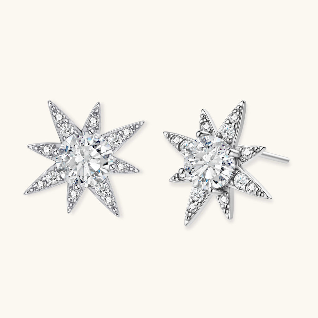 Star-shaped earrings with clear diamonds on a white background