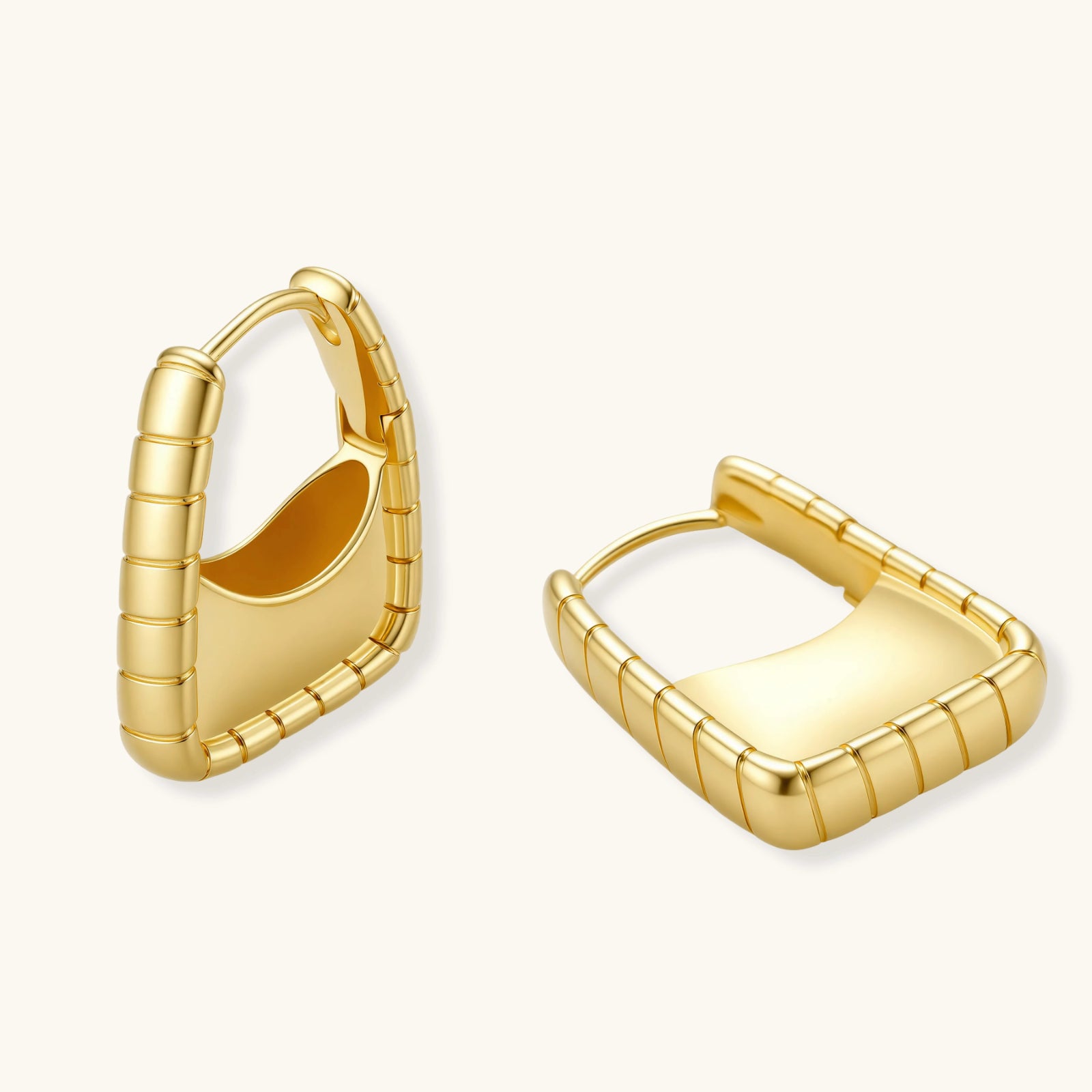Gold hoop earrings on a white background