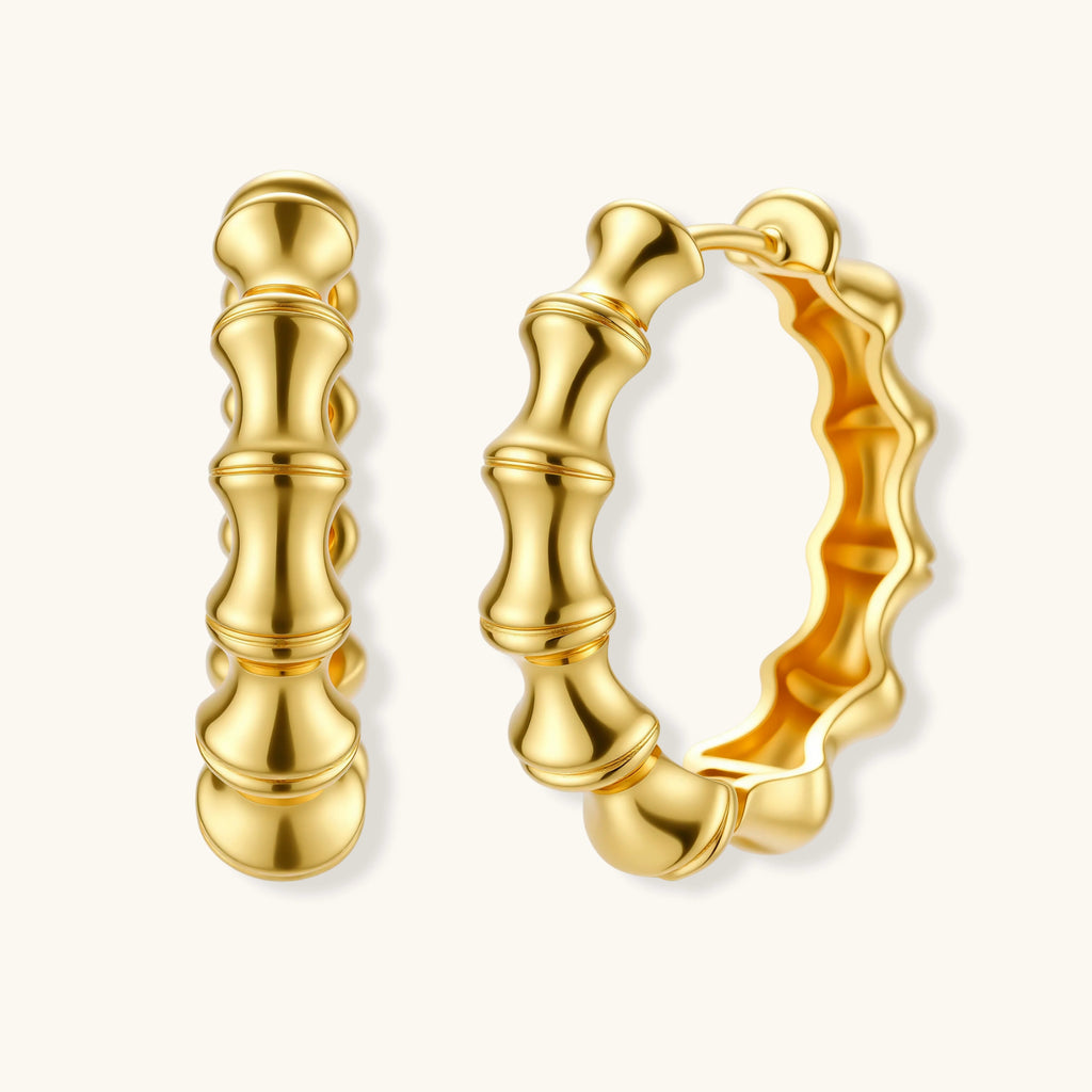 Gold hoop earrings on a white background
