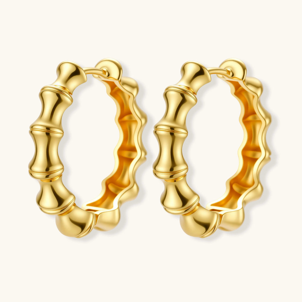Gold hoop earrings on a white background