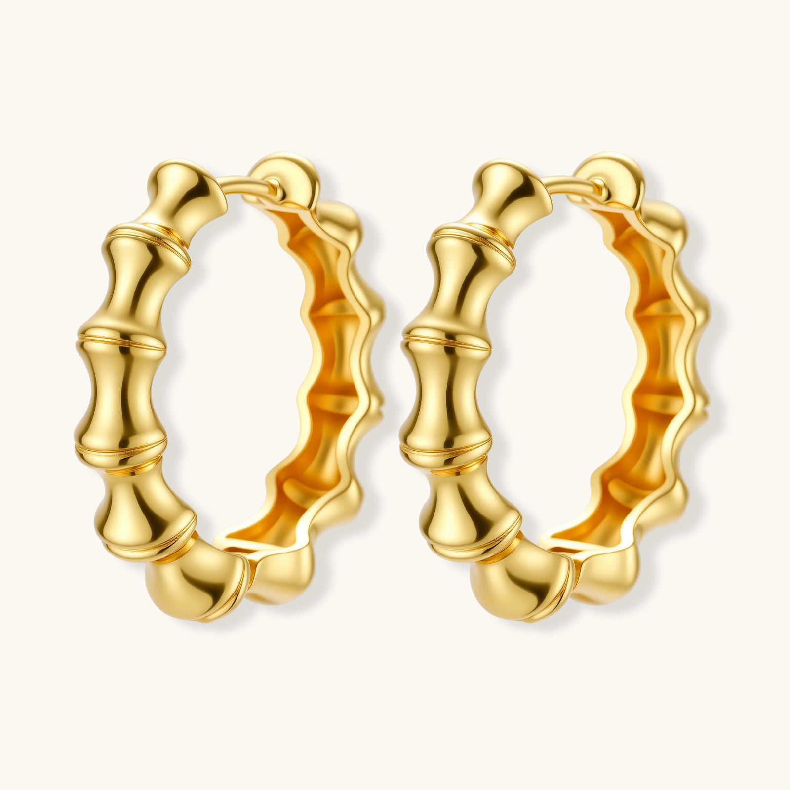 Gold hoop earrings on a white background