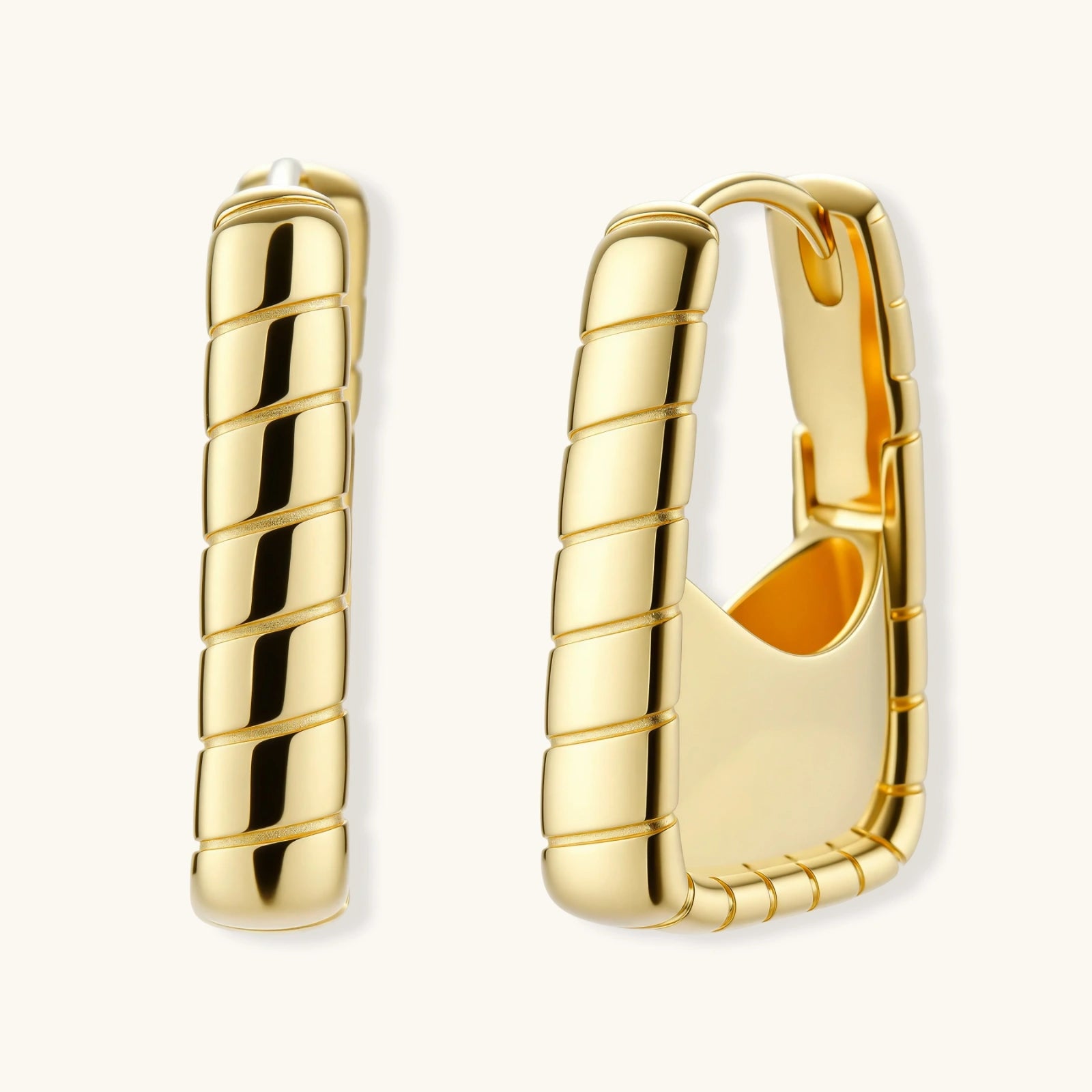 Gold hoop earrings on a white background