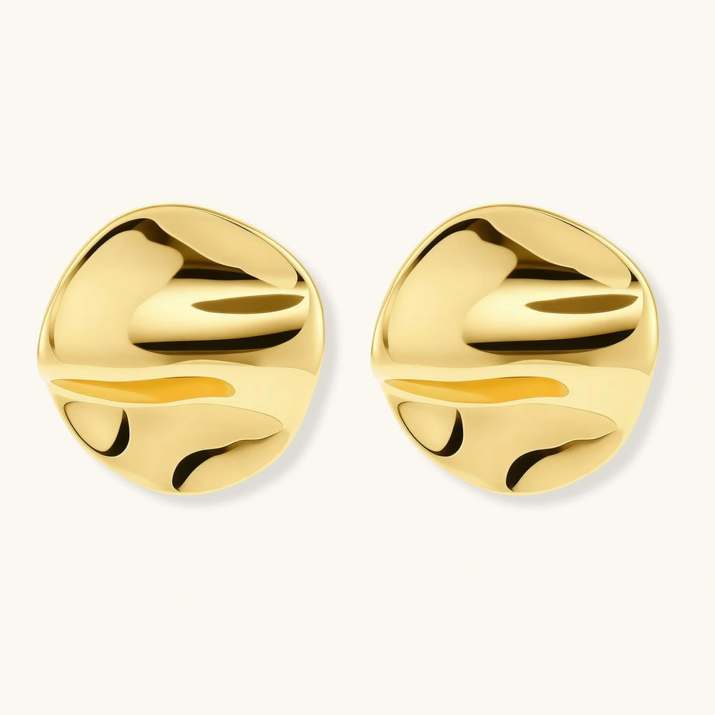 Pair of gold vermeil round earrings on a white background