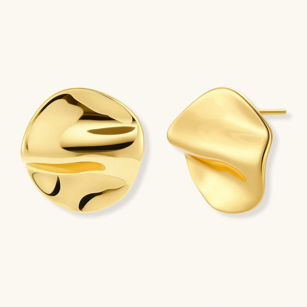 Pair of gold vermeil earrings on a white background