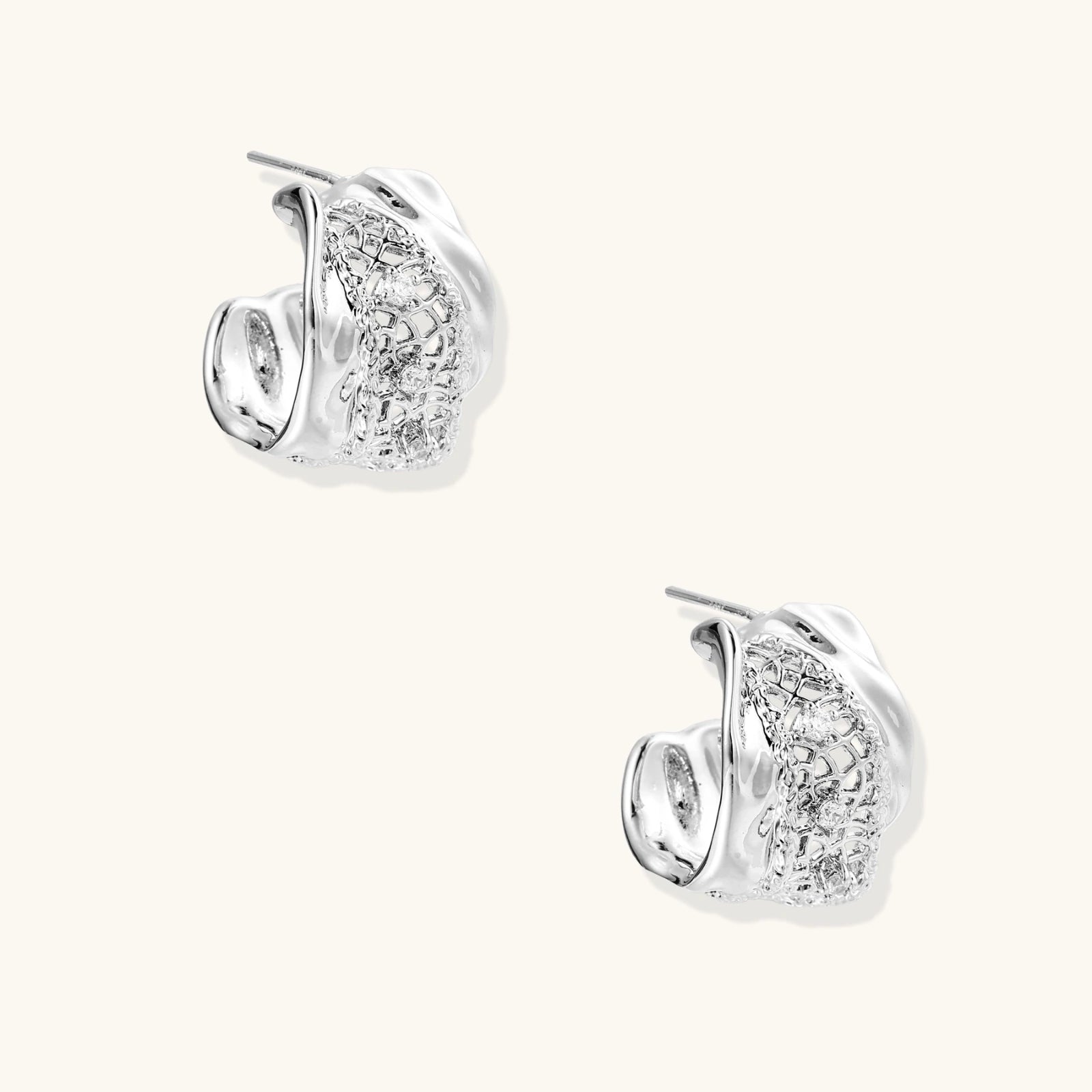 Pair of white gold plated earrings with clear gemstones and mesh design
