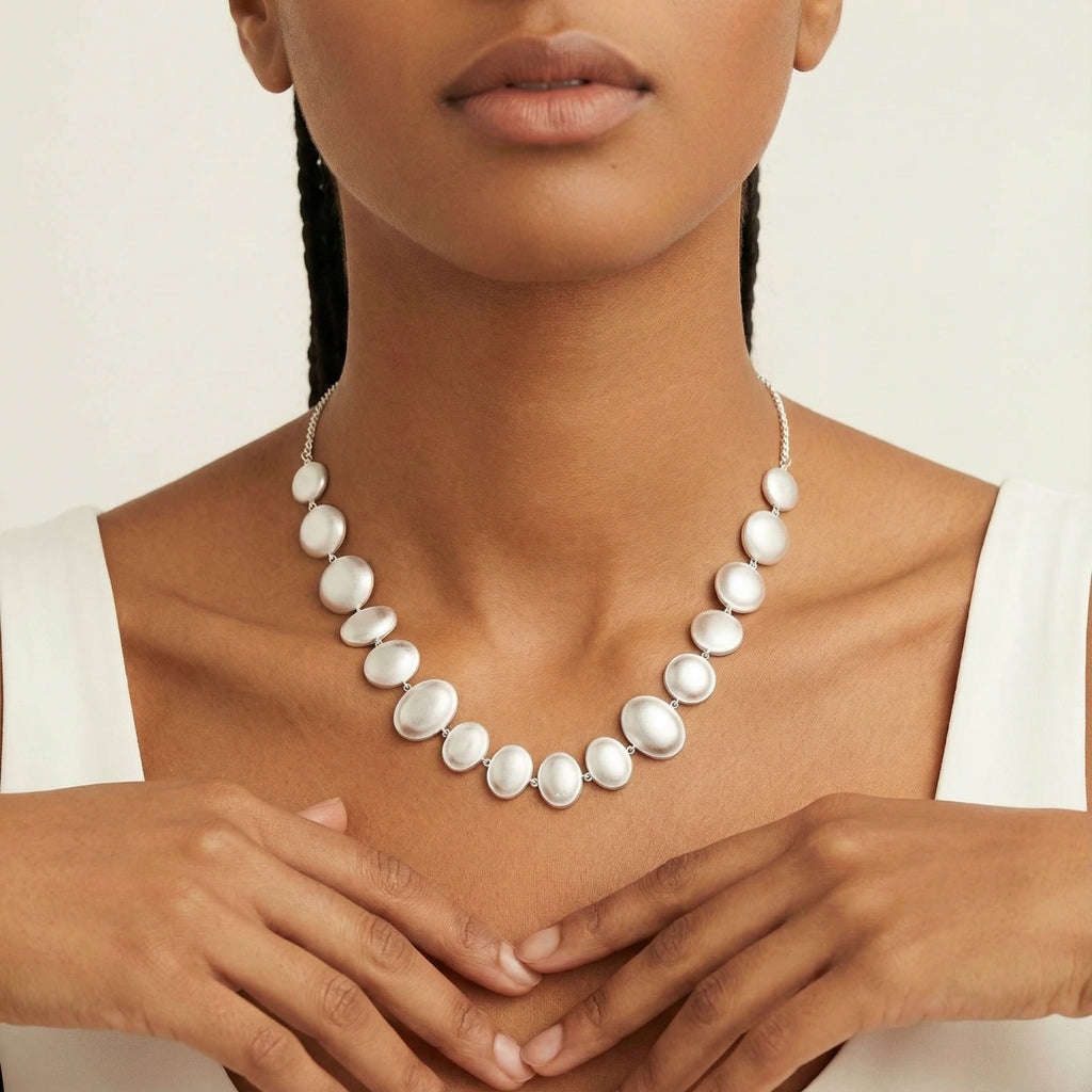 Woman wearing Sterling Silver pearl style statement necklace 