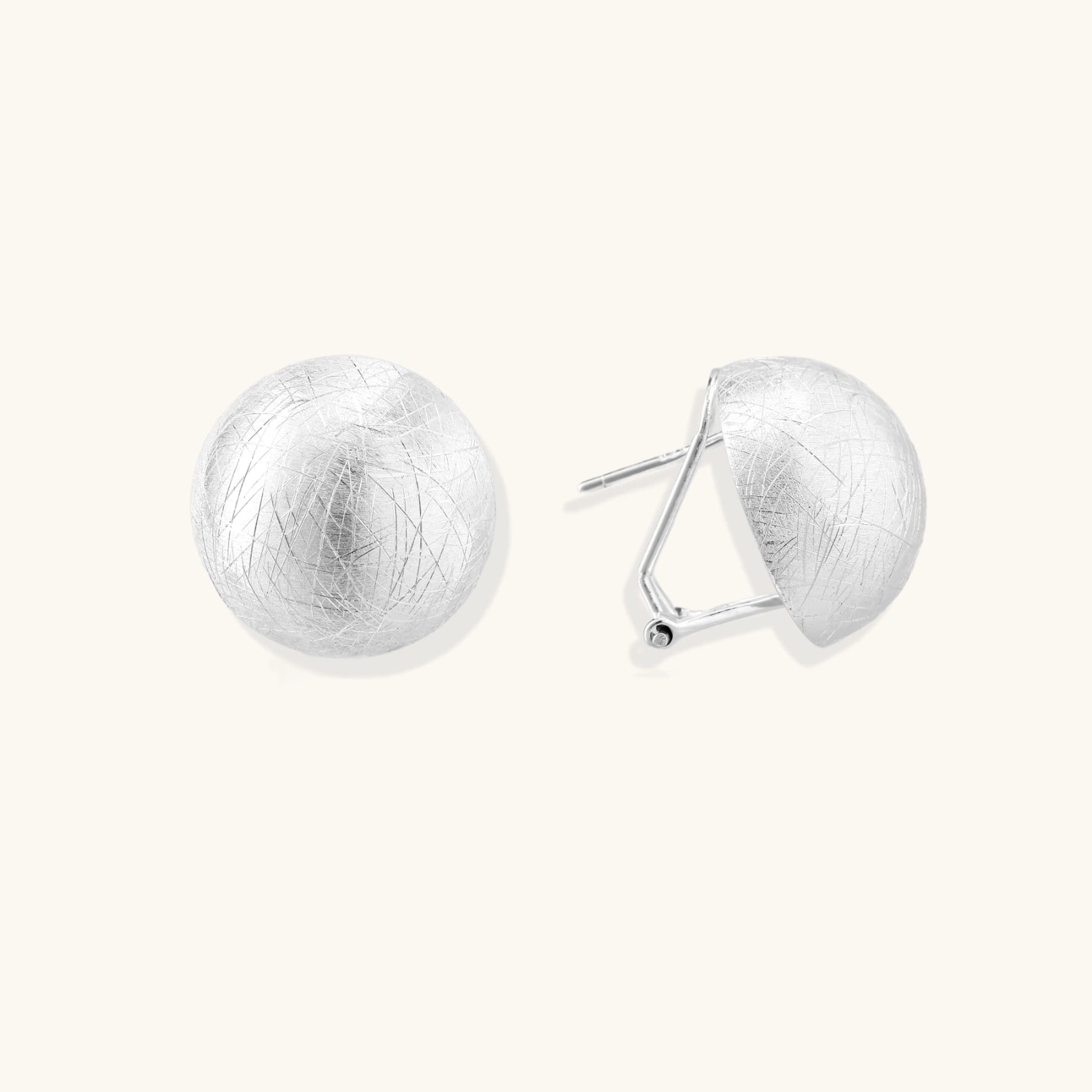 Pair of silver earrings on a white background