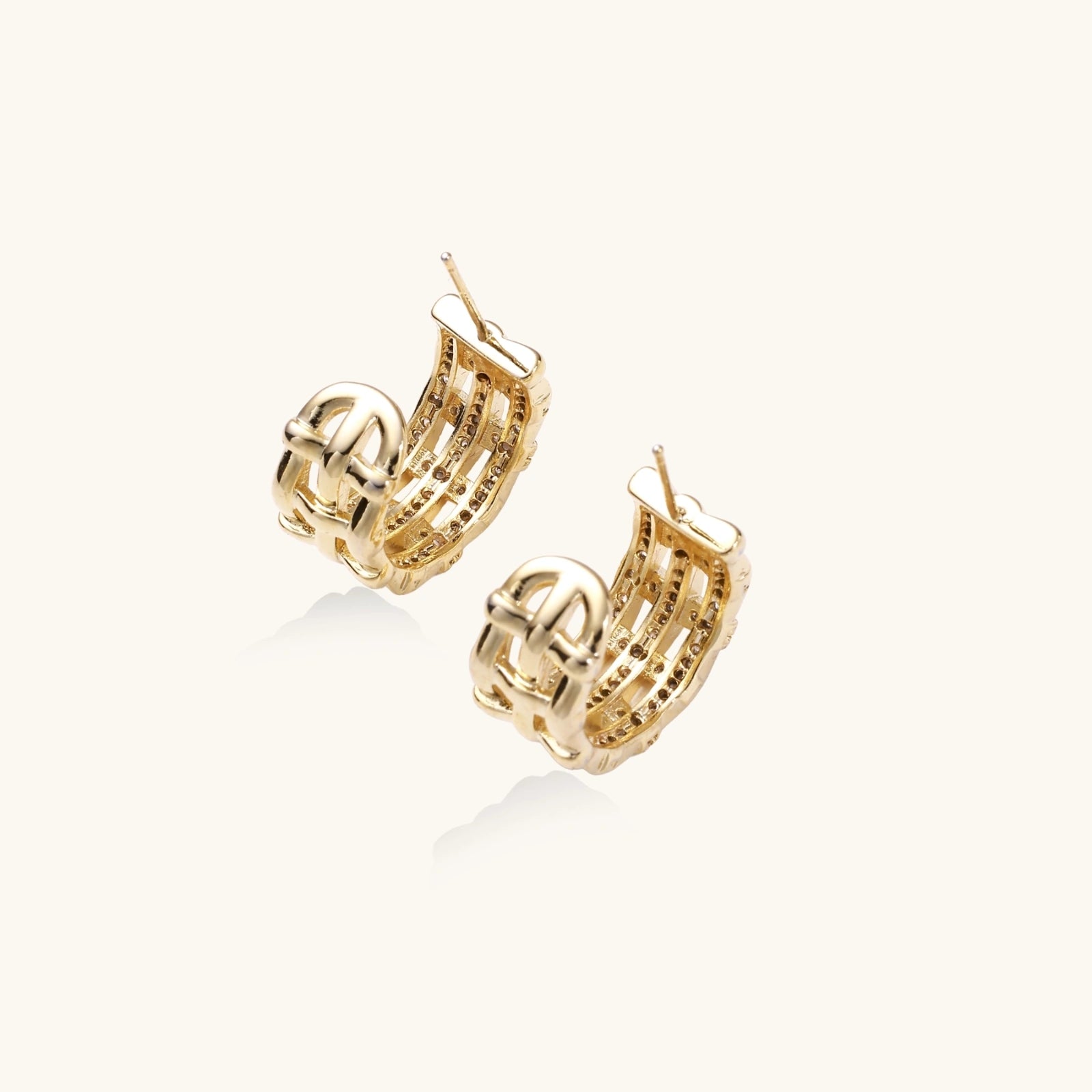 Pair of gold hoop earrings on a white background