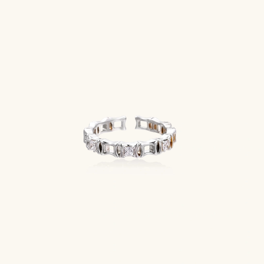 White gold plated ring with zirconia stones on a white background