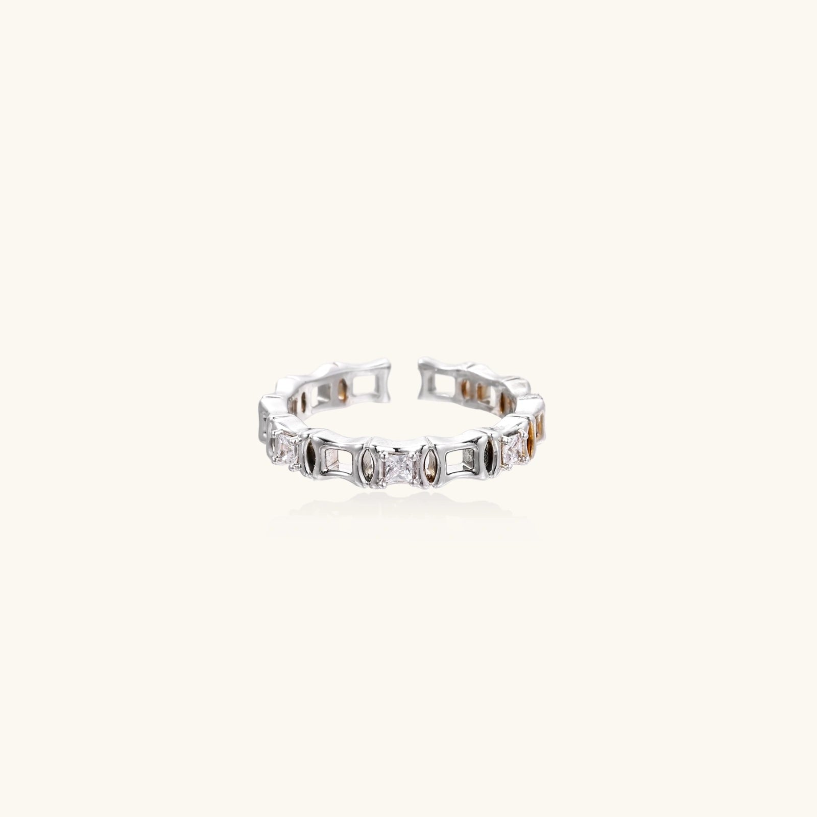 White gold plated ring with zirconia stones on a white background