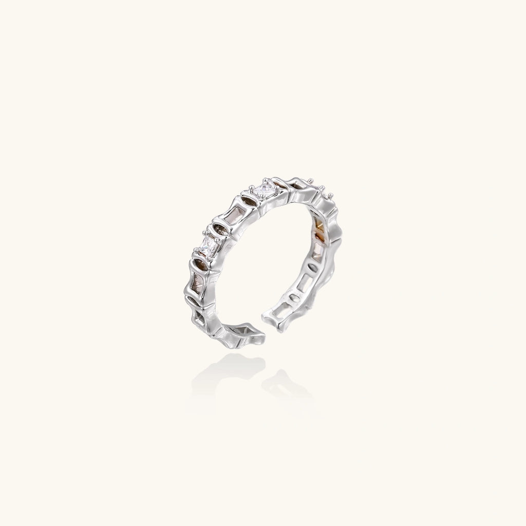 Silver ring with gemstones on a white background