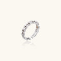 Silver ring with gemstones on a white background