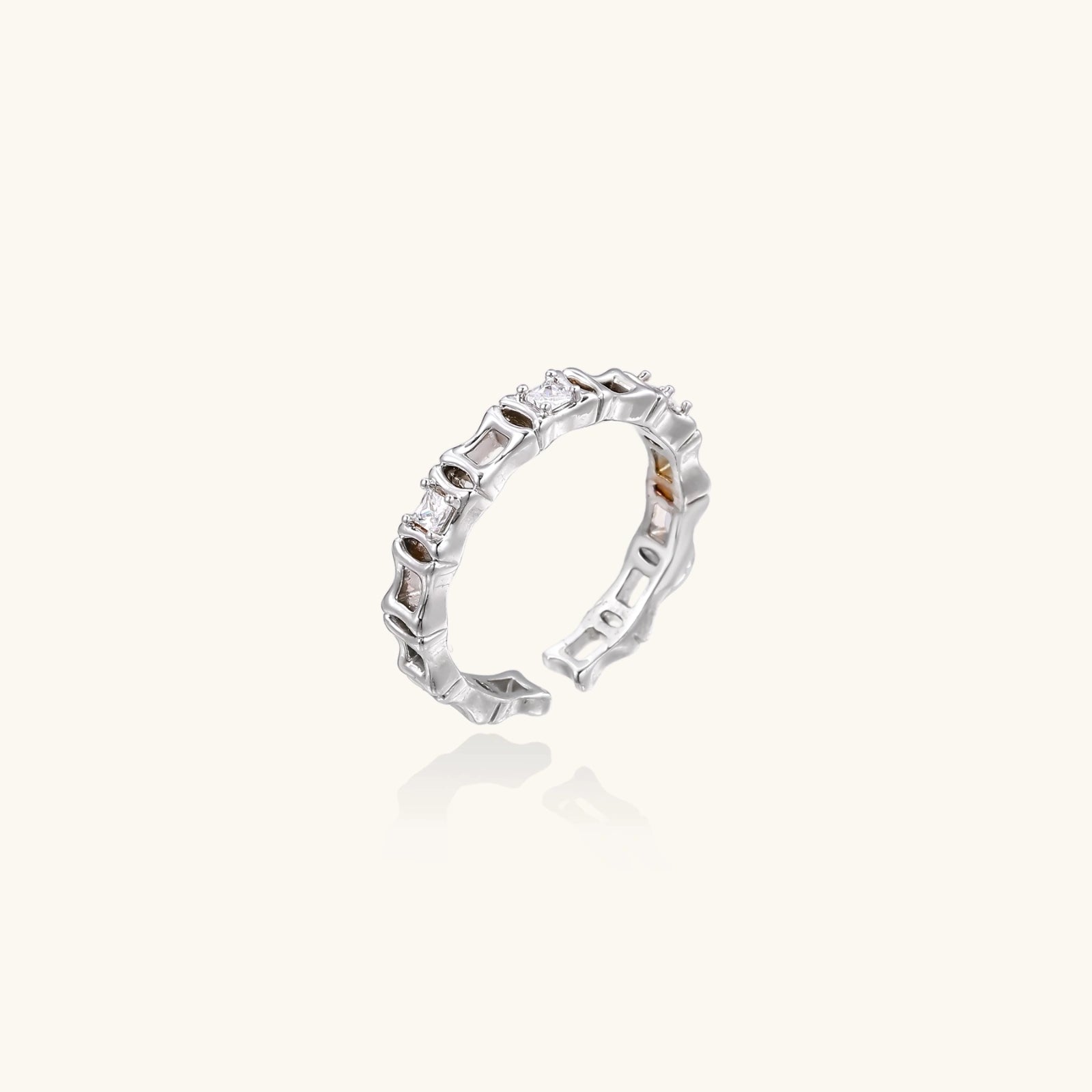 Silver ring with gemstones on a white background