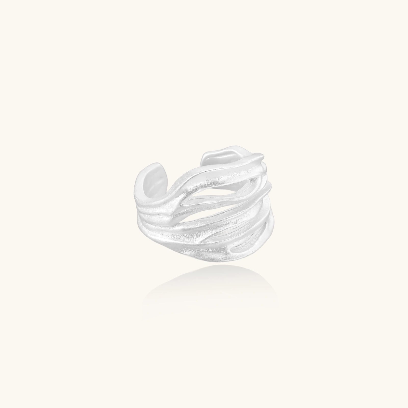 sterling silver ring with wavy design on a white background