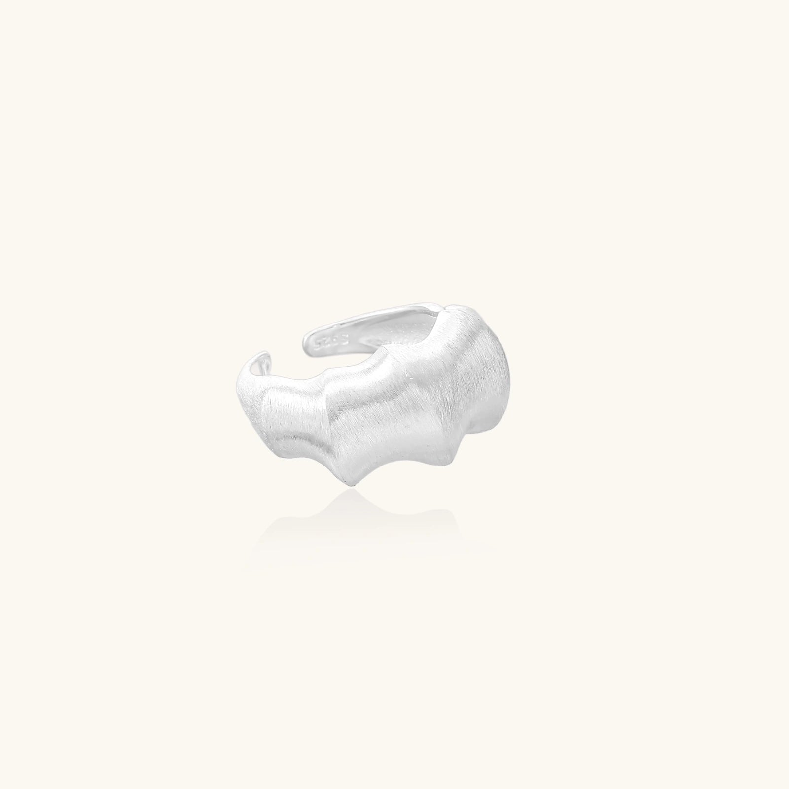 Silver cuff ring on a white background