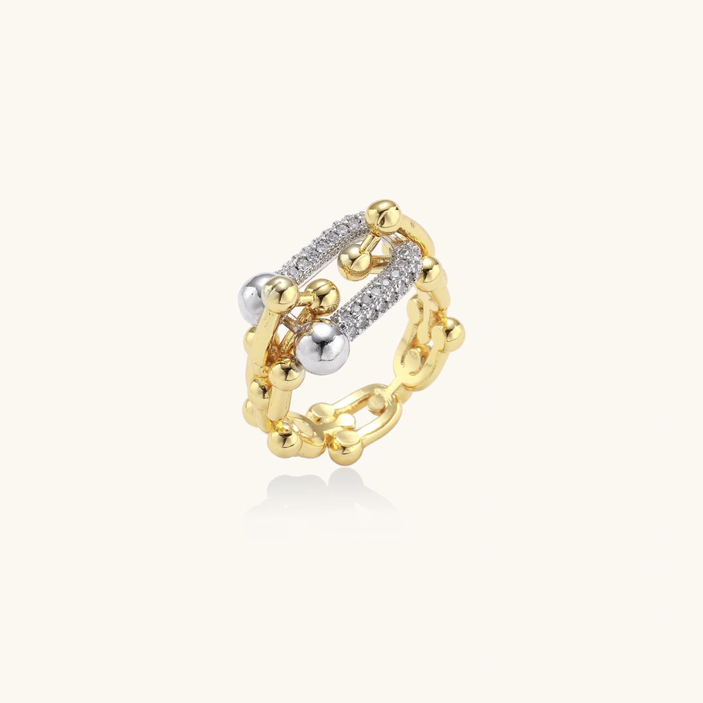 Gold and silver shimmer ring on a white background