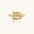 Gold ring with diamond accents on a white background