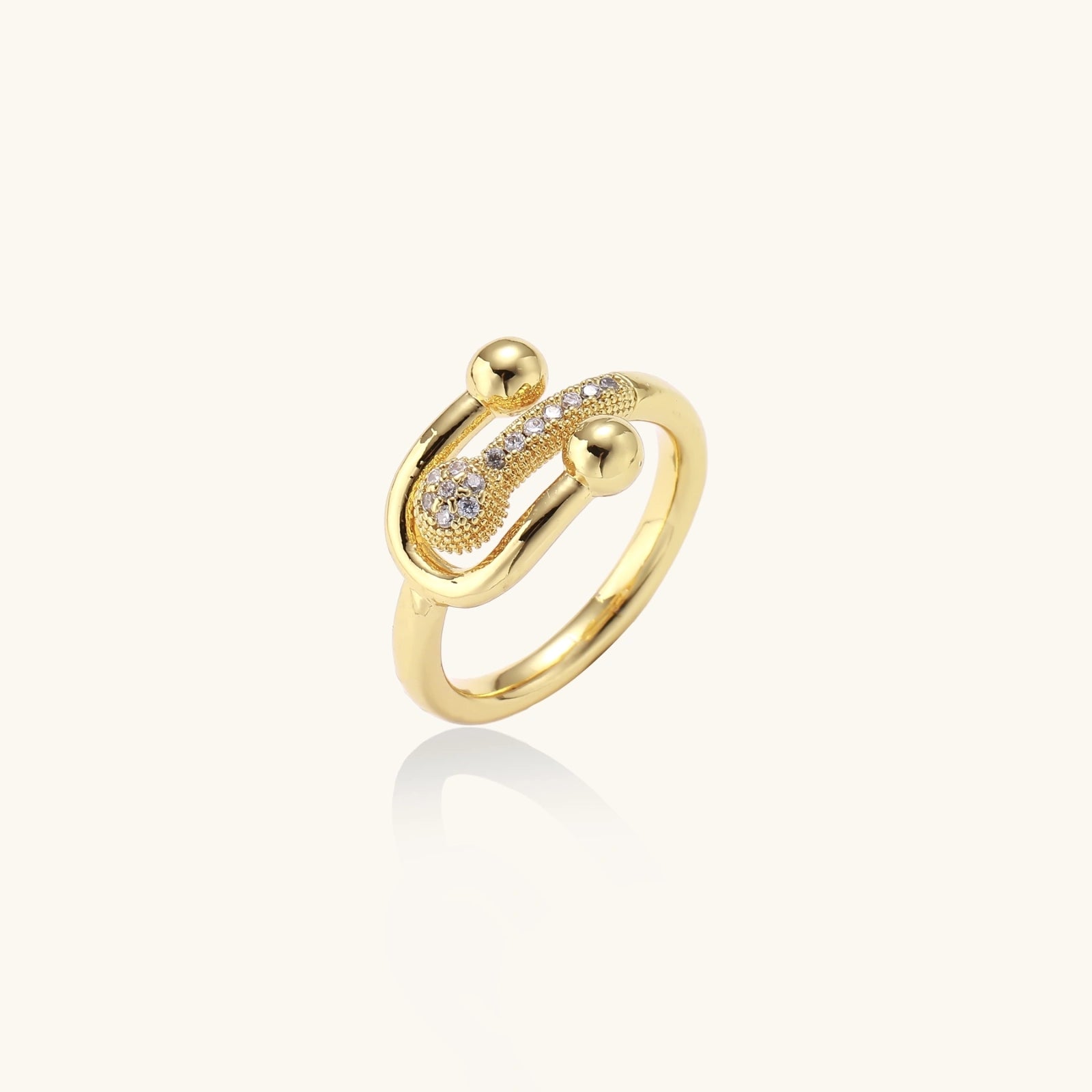 Gold ring with small diamonds on a white background