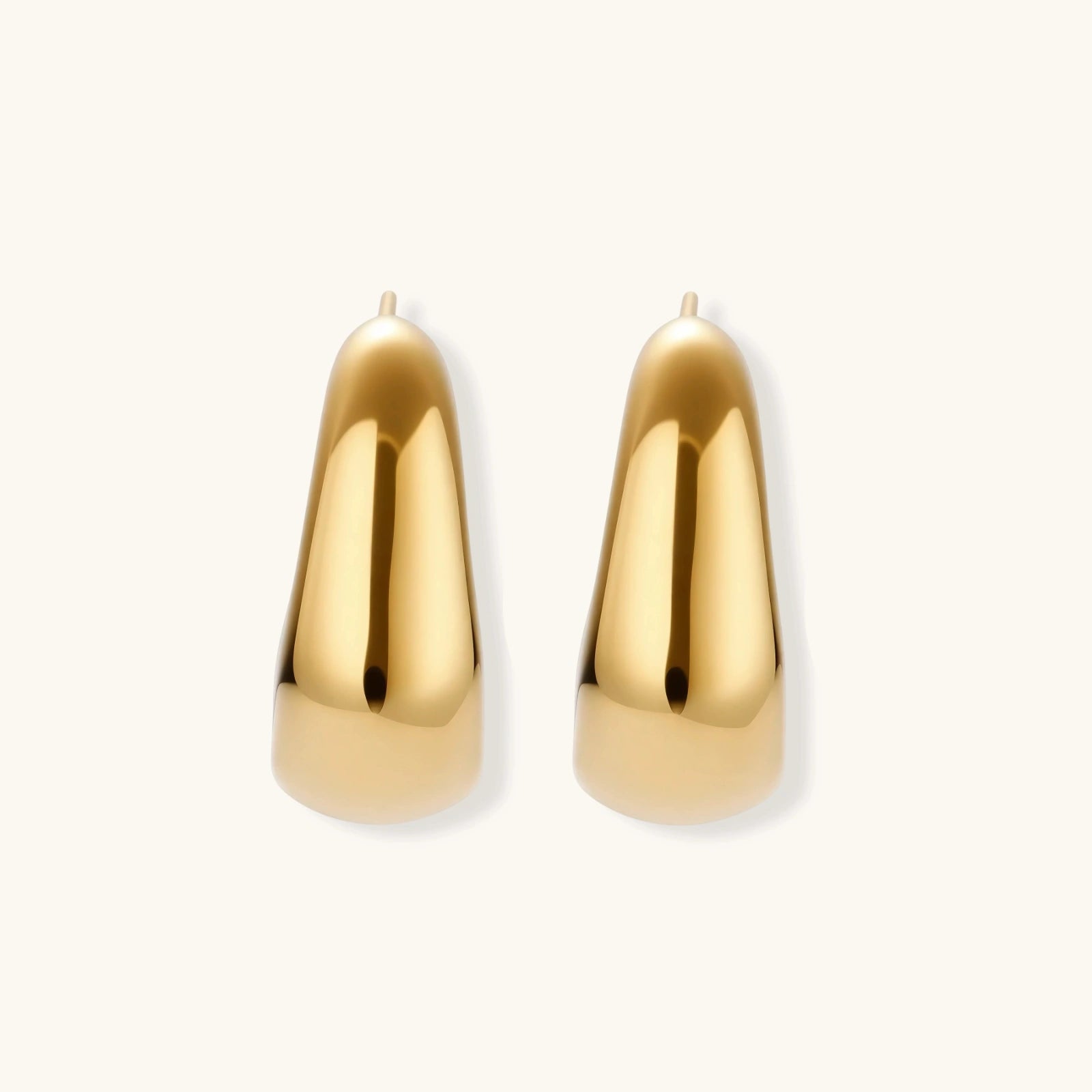 Gold earrings on a white background
