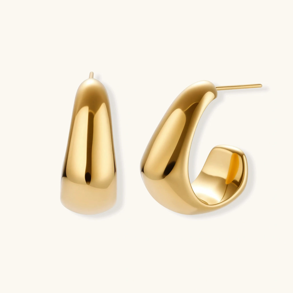 Gold hoop earrings on a white background