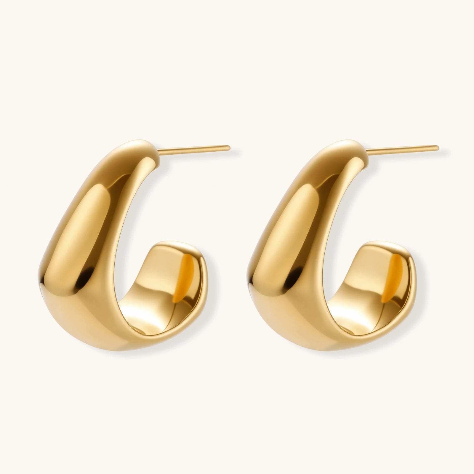 Gold hoop earrings on a white background