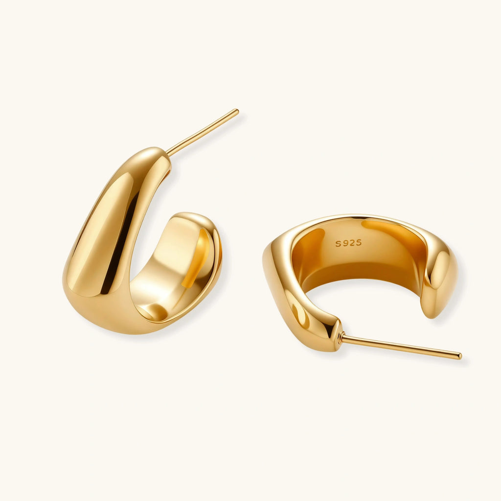Gold vermeil hoop earrings on a white background
