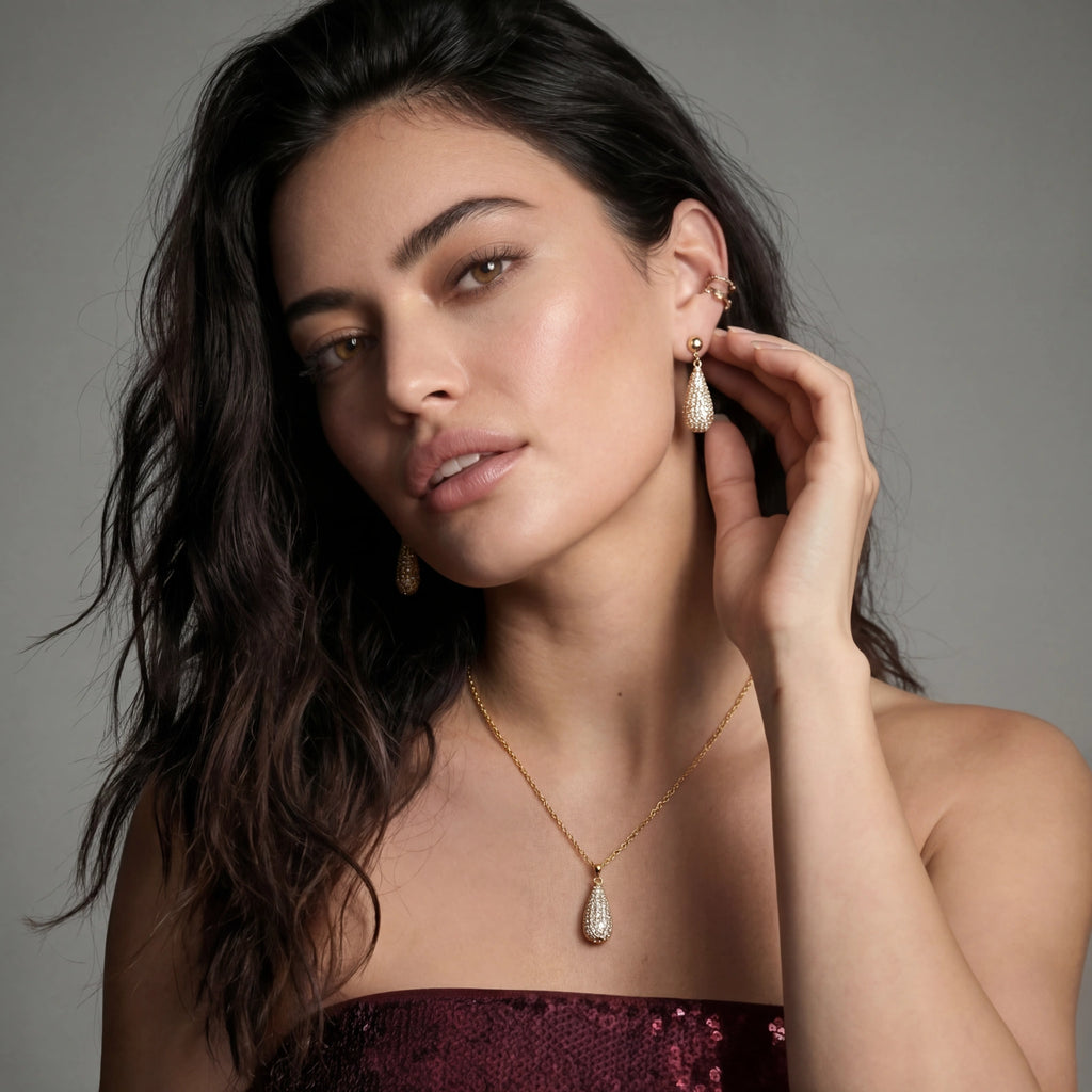 Woman wearing jewelry with a gray background