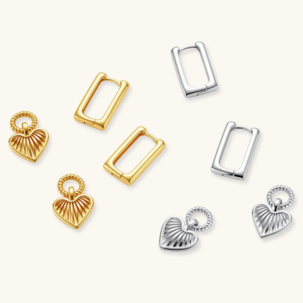 Collection of gold and silver earrings on a white background