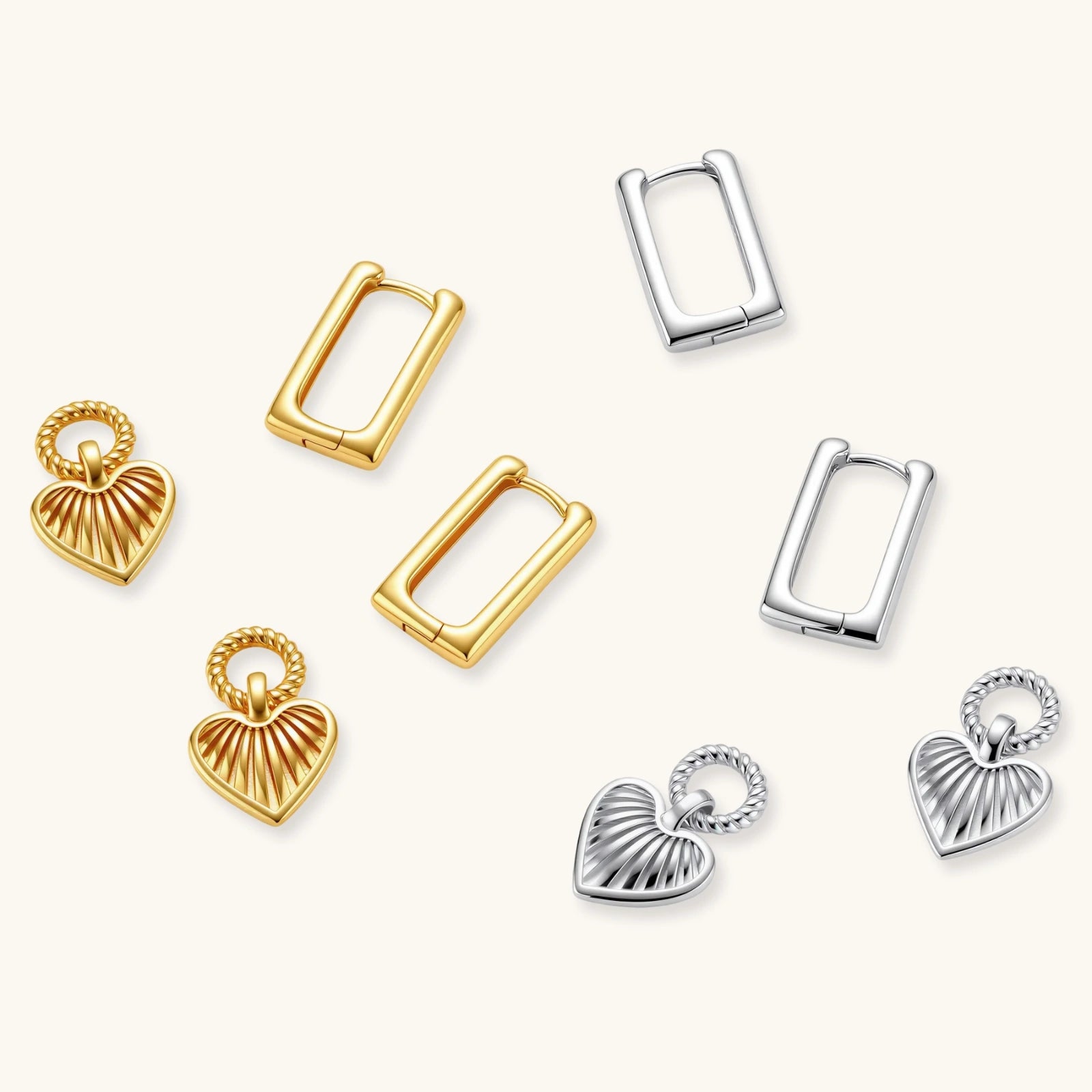 Collection of gold and silver earrings on a white background
