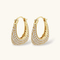 Gold hoop earrings with embedded stones on a white background