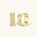 Gold hoop earrings with diamond accents on a white background