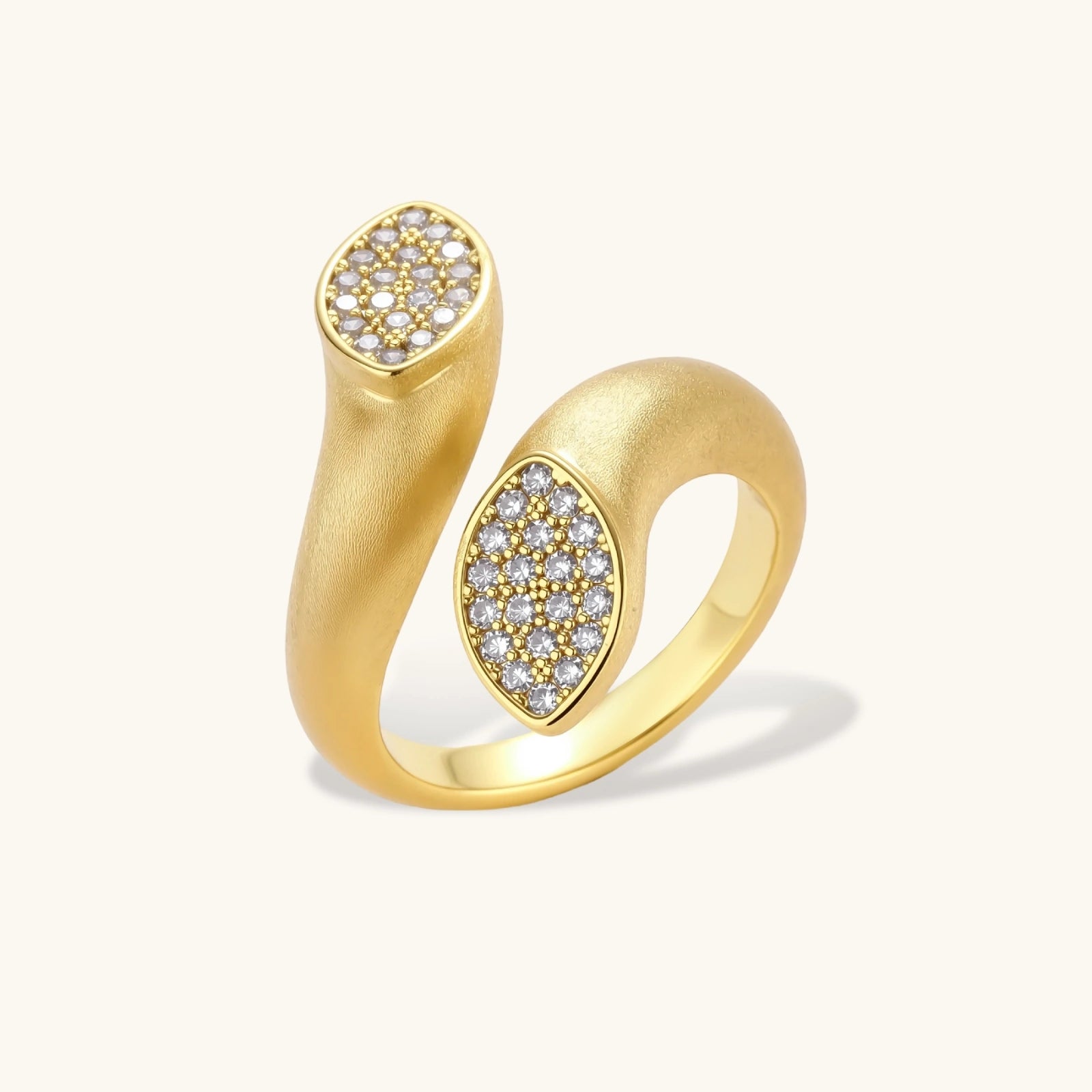 Gold ring with diamond accents on a white background