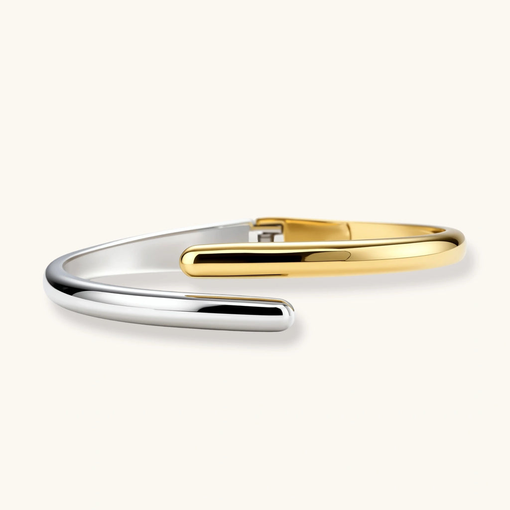 Two-toned gold and silver bracelet on a white background