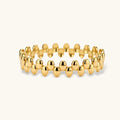Gold beaded bracelet on a white background