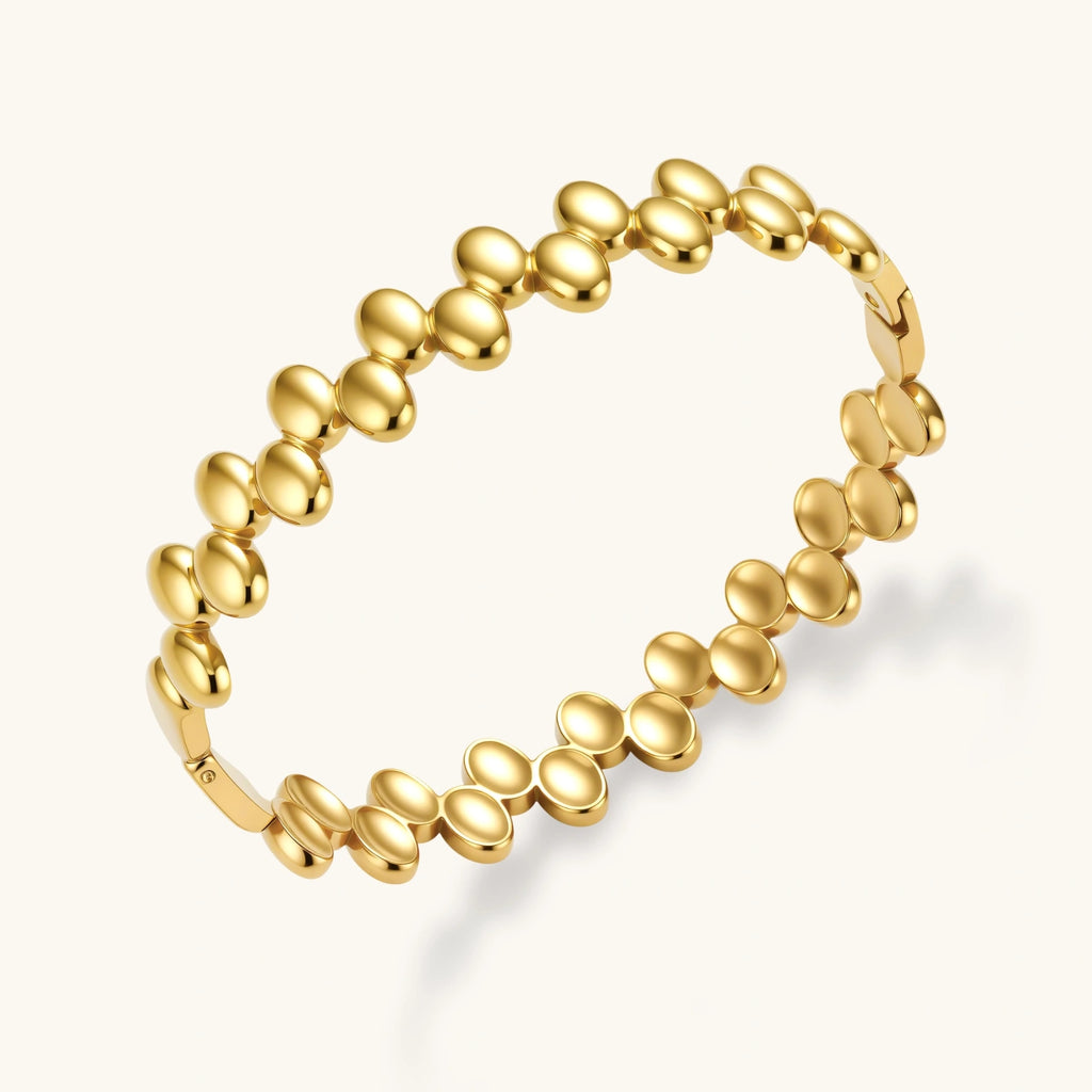 Gold cuff with circular deisgn