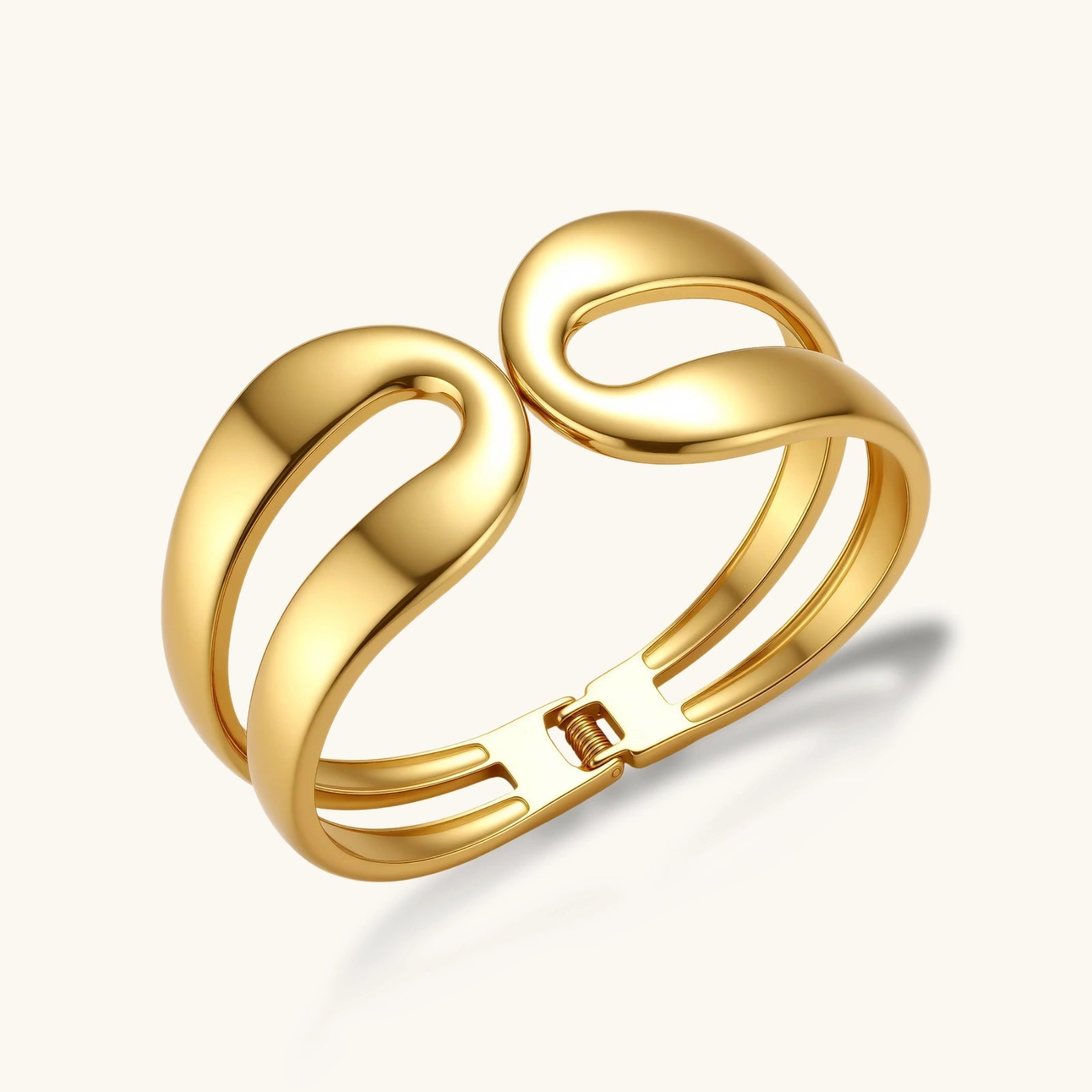 Gold bracelet with a clasp on a white background