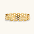 Gold bracelet with a geometric pattern on a white background